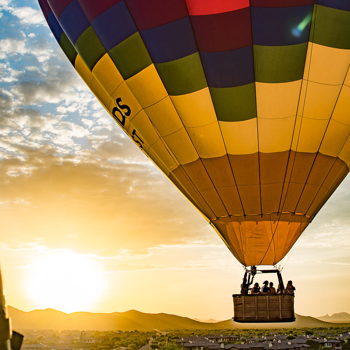 Hot air balloons over Albuquerque with mountain backdrop