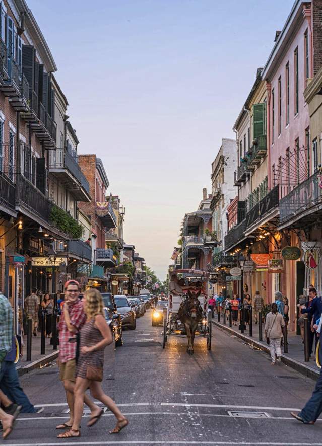 New Orleans French Quarter with historic buildings and vibrant street life